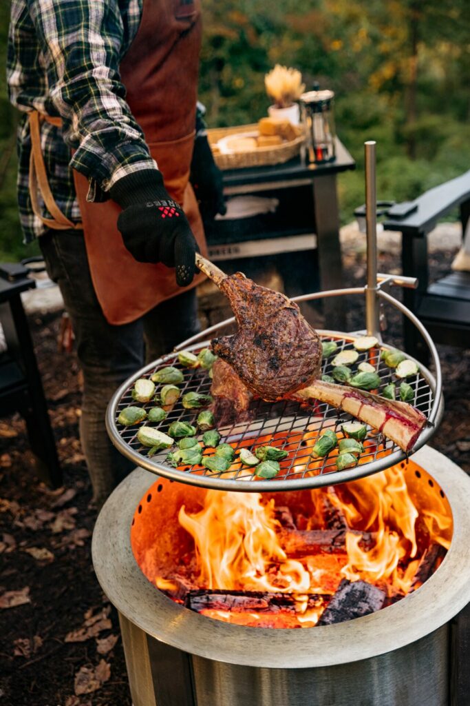 Cooking on a Breeo Fire Pit Outpost Grill