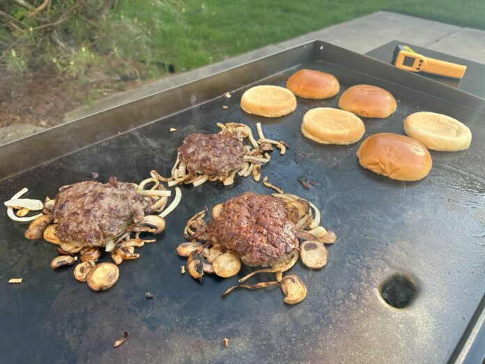 Burgers Cooking on a Griddle