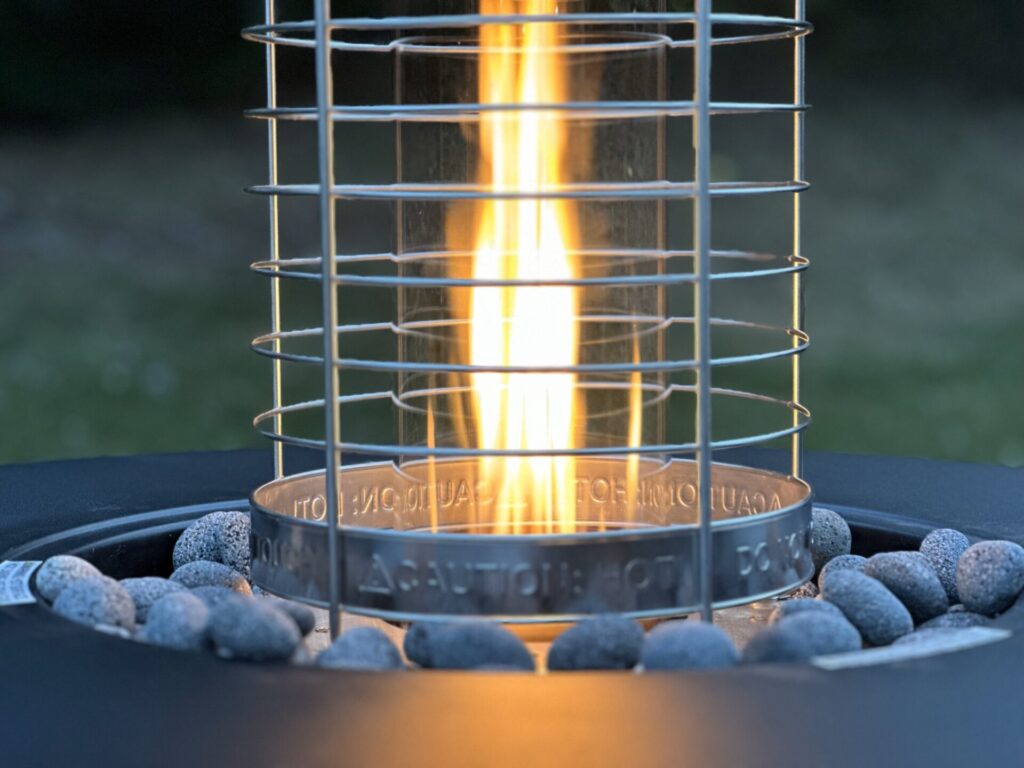 TIKI Brand Propane Fire Pit with Table and Patio Heater - Close